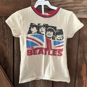 Two 3T t- shirts.  
Beatles and Mickey and Minnie